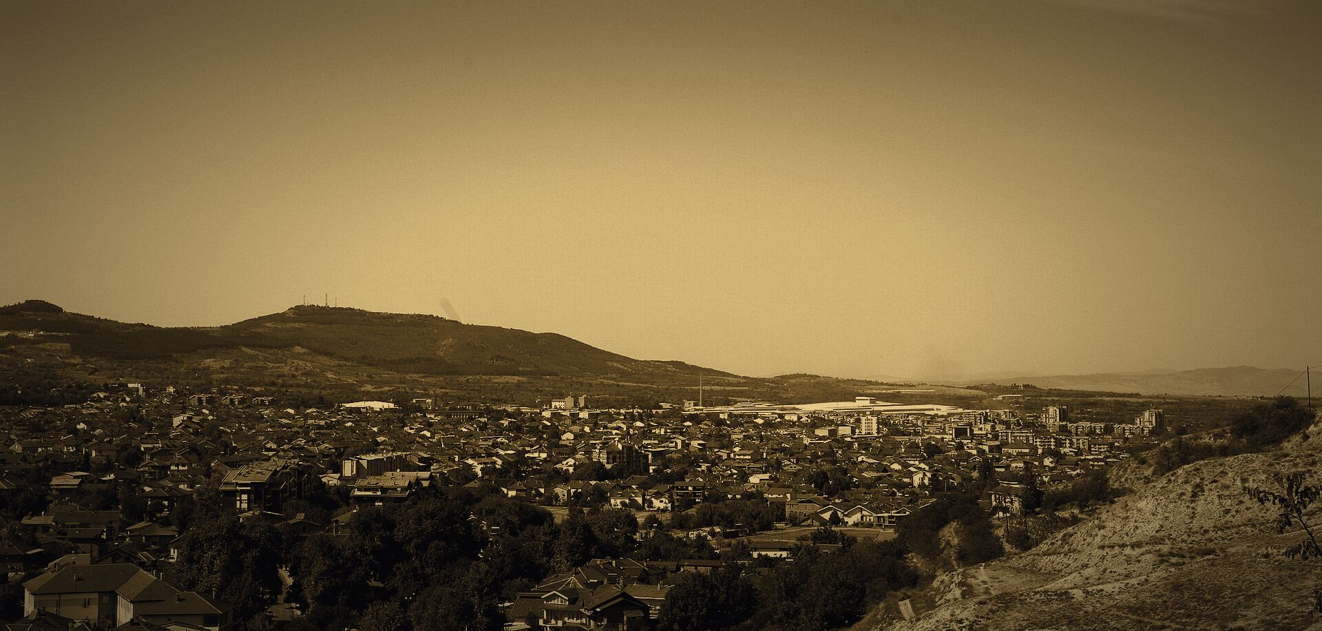 Kavadarci seen from the hill above the town, the Tikveš plain and mountains behind